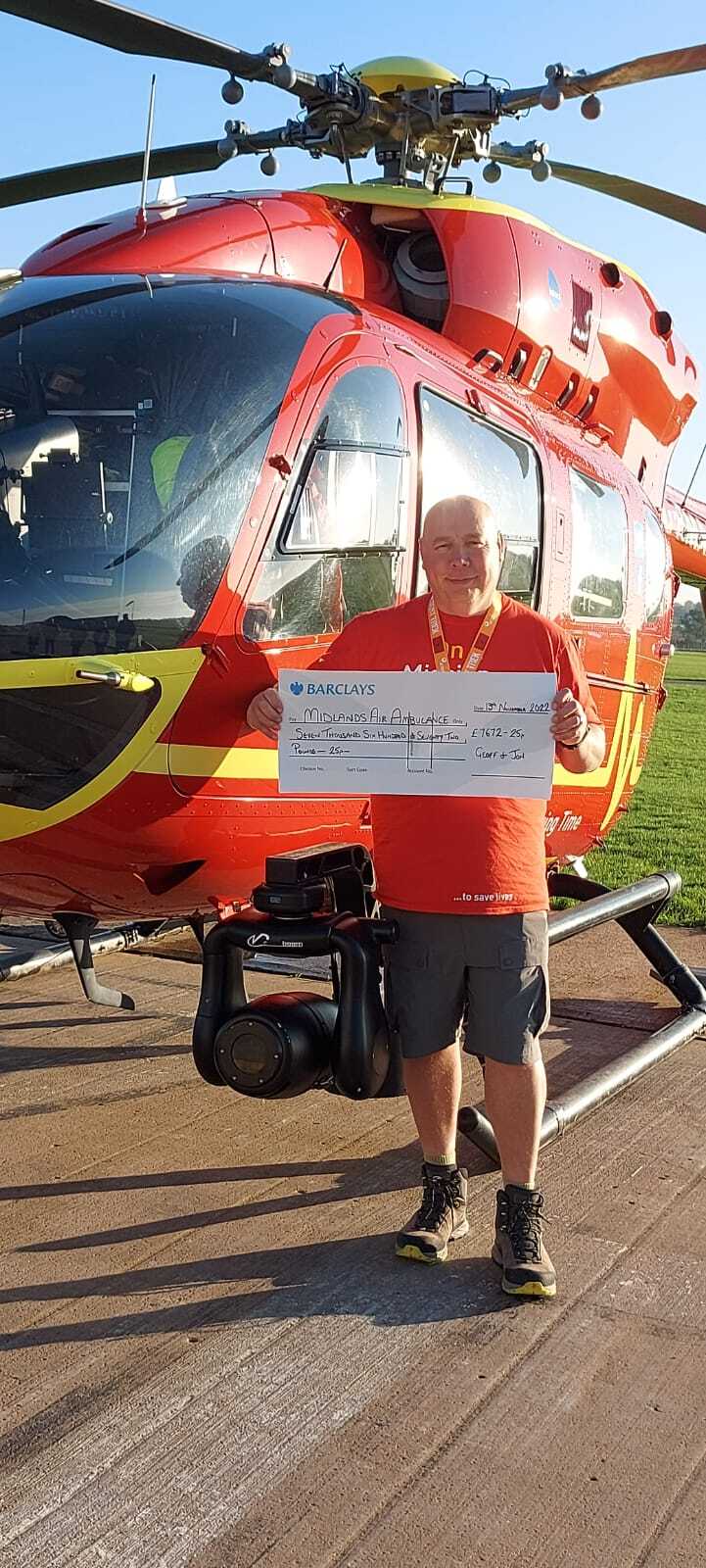 Jon handing over the fundraising