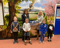 Sales Executive, Jean Embrey and children from Orleton CE Primary School.