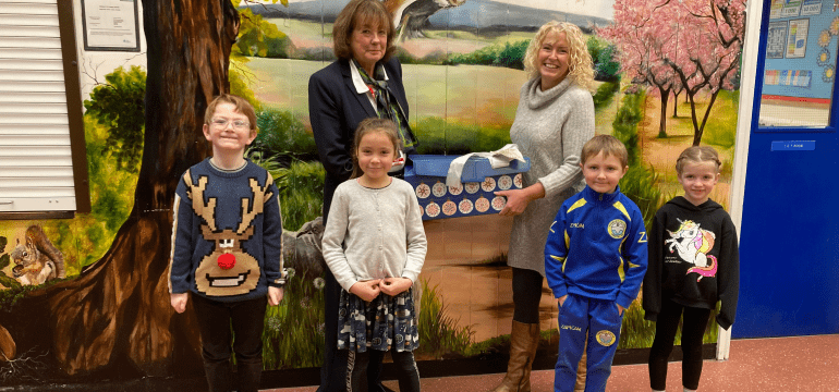 Sales Executive, Jean Embrey and children from Orleton CE Primary School.