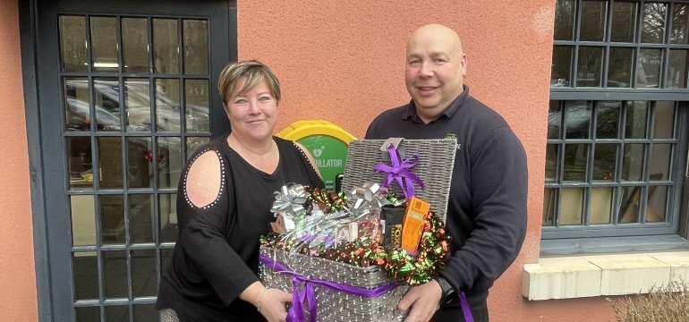 Jon presenting hamper to winner - Sarah