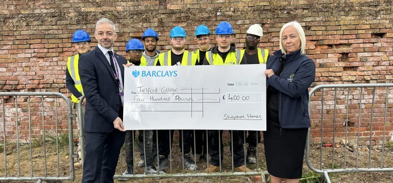 Handing over the donation to Telford College