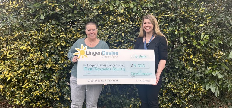 Sarah with her £5000 cheque