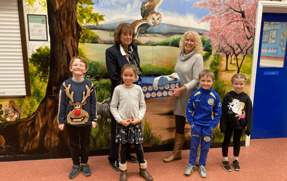 Sales Executive, Jean Embrey and children from Orleton CE Primary School.