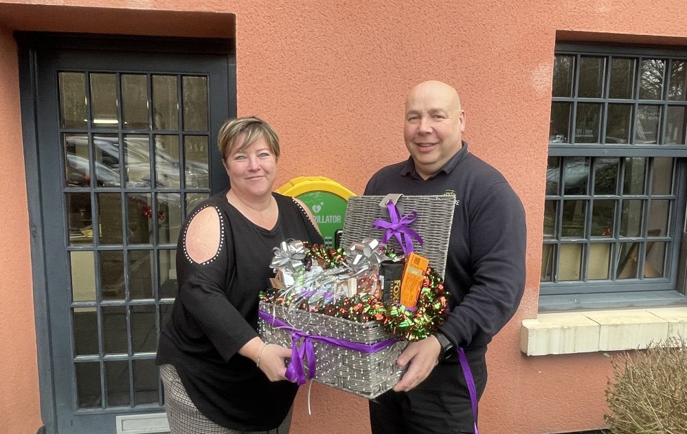 Jon presenting hamper to winner - Sarah